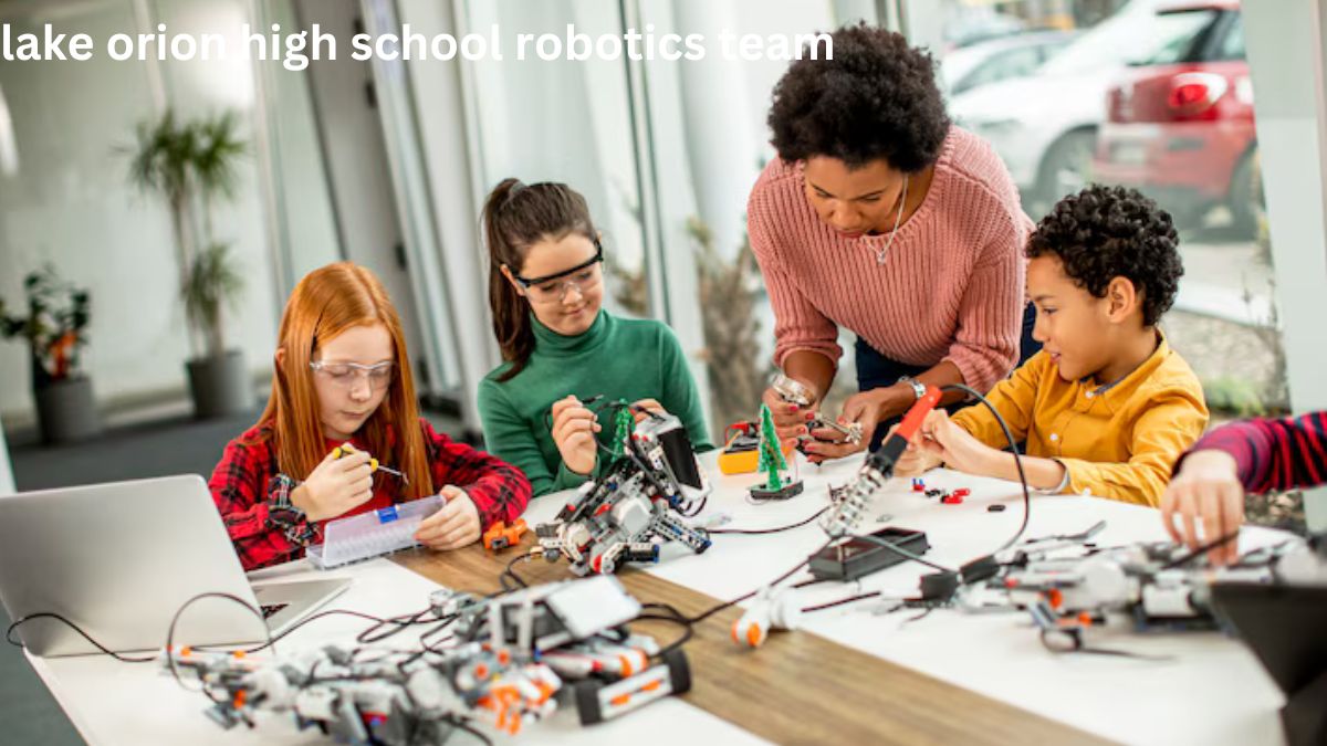 Lake Orion High School Robotics Team showcasing their robot during a competition.